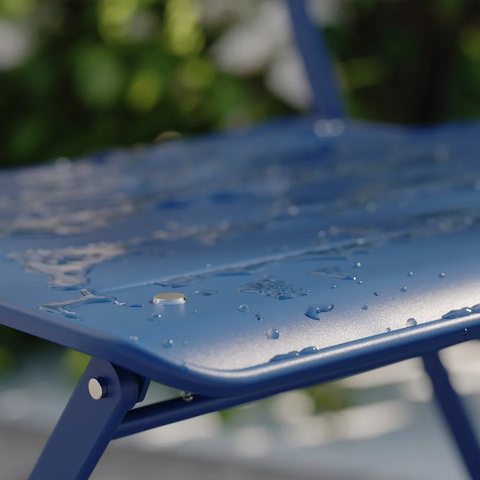 SUNDSÖ blue metal table, pre-assembled, foldable, water droplets on surface.