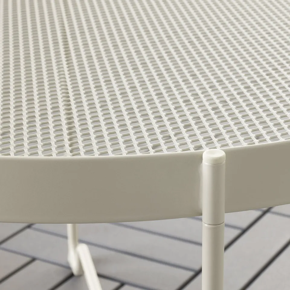 Close-up of KROKHOLMEN table: durable mesh top, sturdy legs, smooth finish.