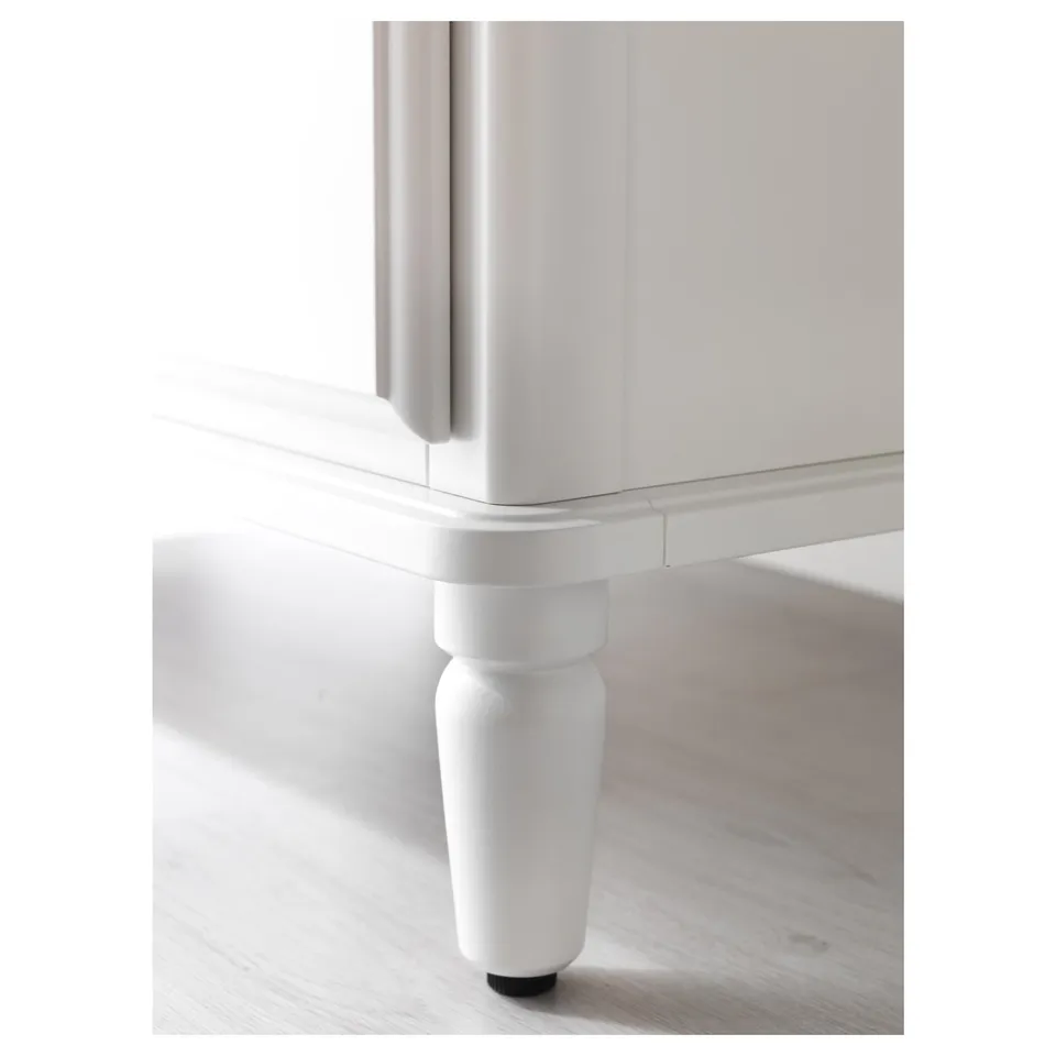 Close-up of TYSSEDAL dresser leg, smooth painted finish, sturdy design.