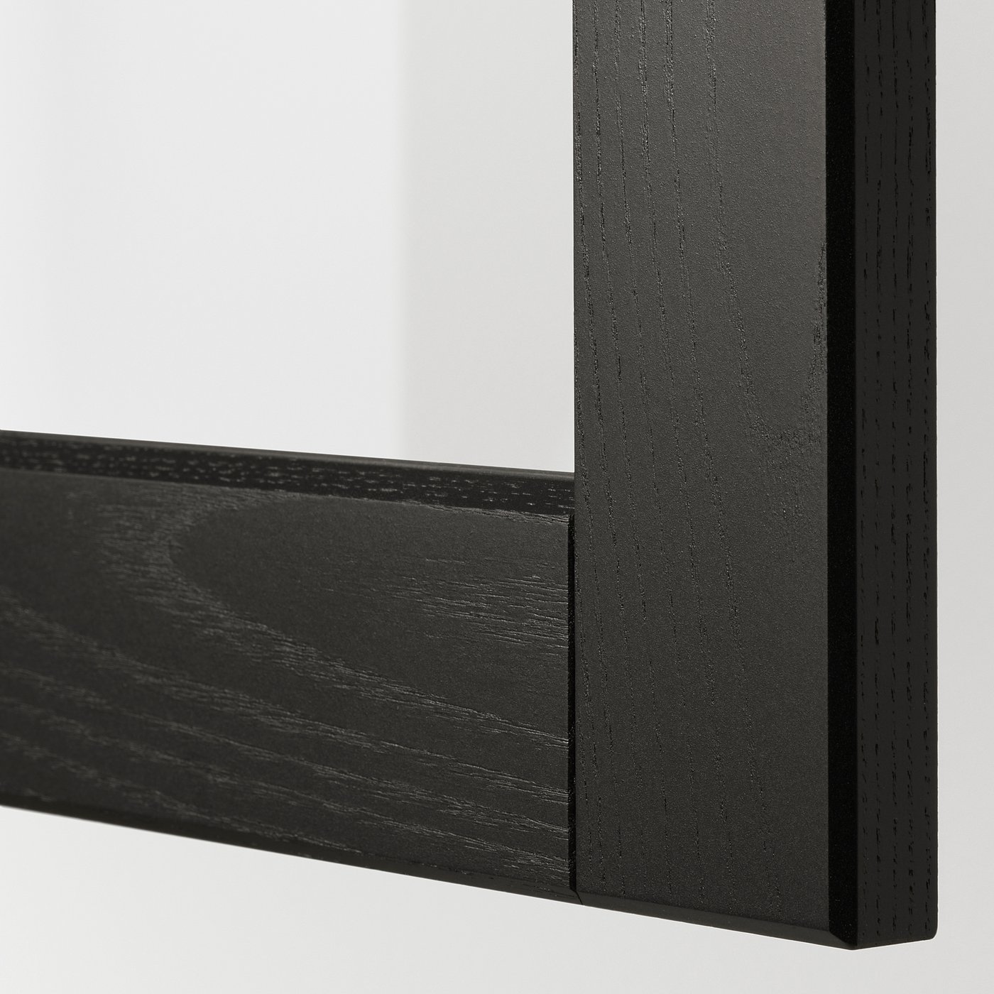Black wooden frame with bevelled edges. Close-up shows quality finish and craftsmanship.