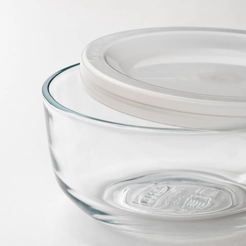 Two stacking glass food containers with clear lids, transparent for easy viewing.