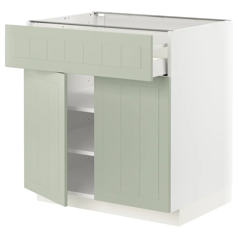 A METOD kitchen cabinet in green with a smooth drawer and two shelves, featuring a crafted design.