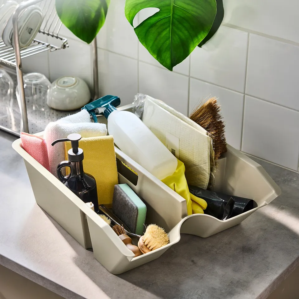 White SORTERA bin with cleaning supplies, multi-compartments.