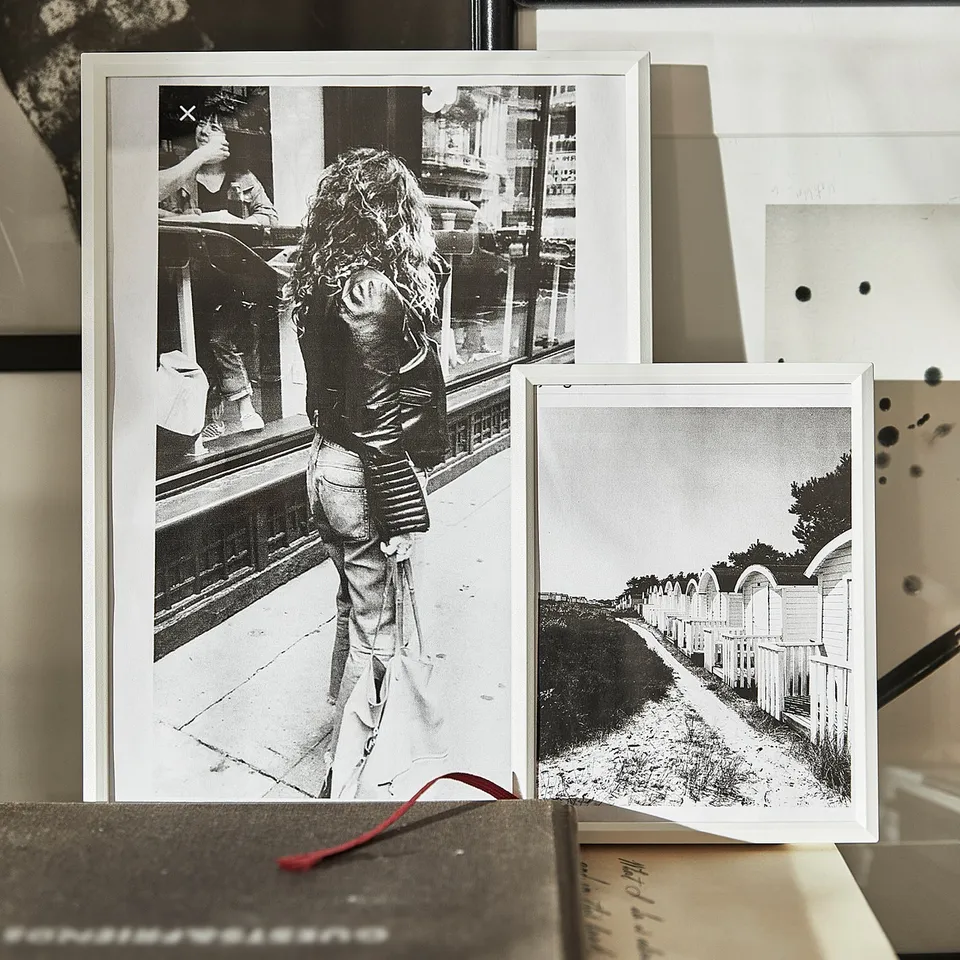 Black and white photos in various frames, minimalist design.