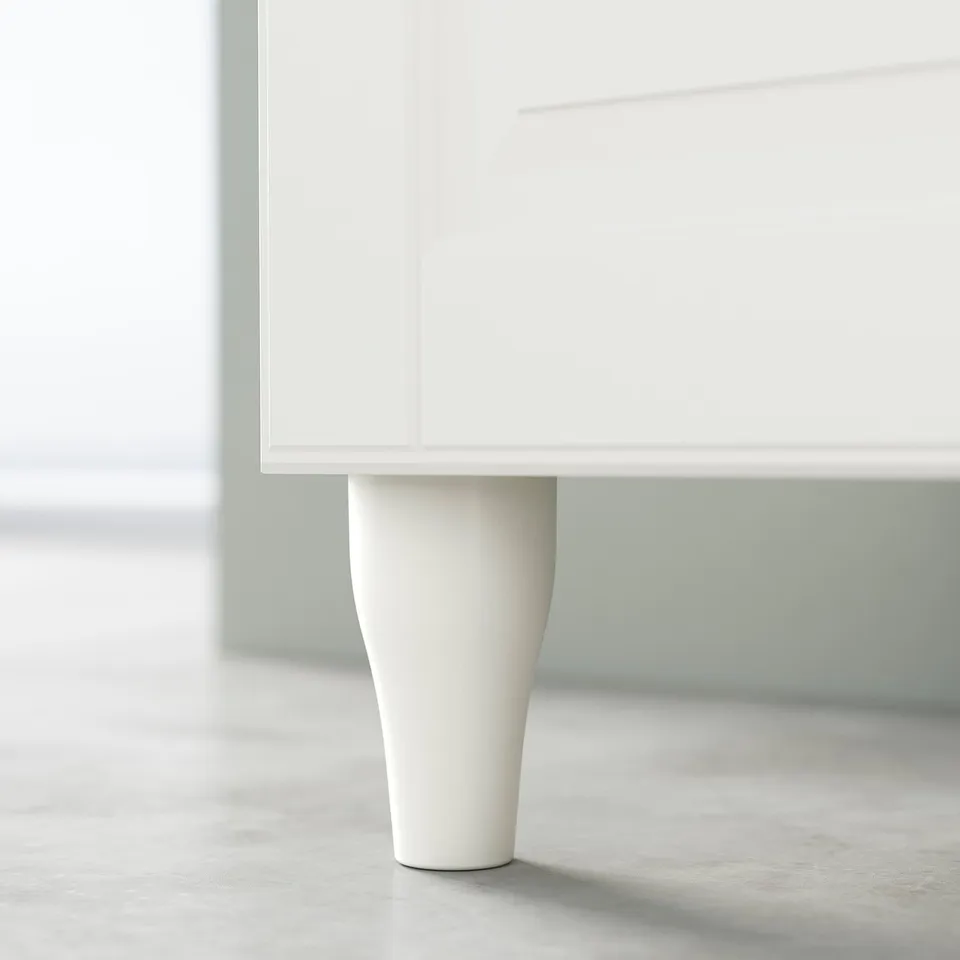 White cabinet leg, curved bamboo design.