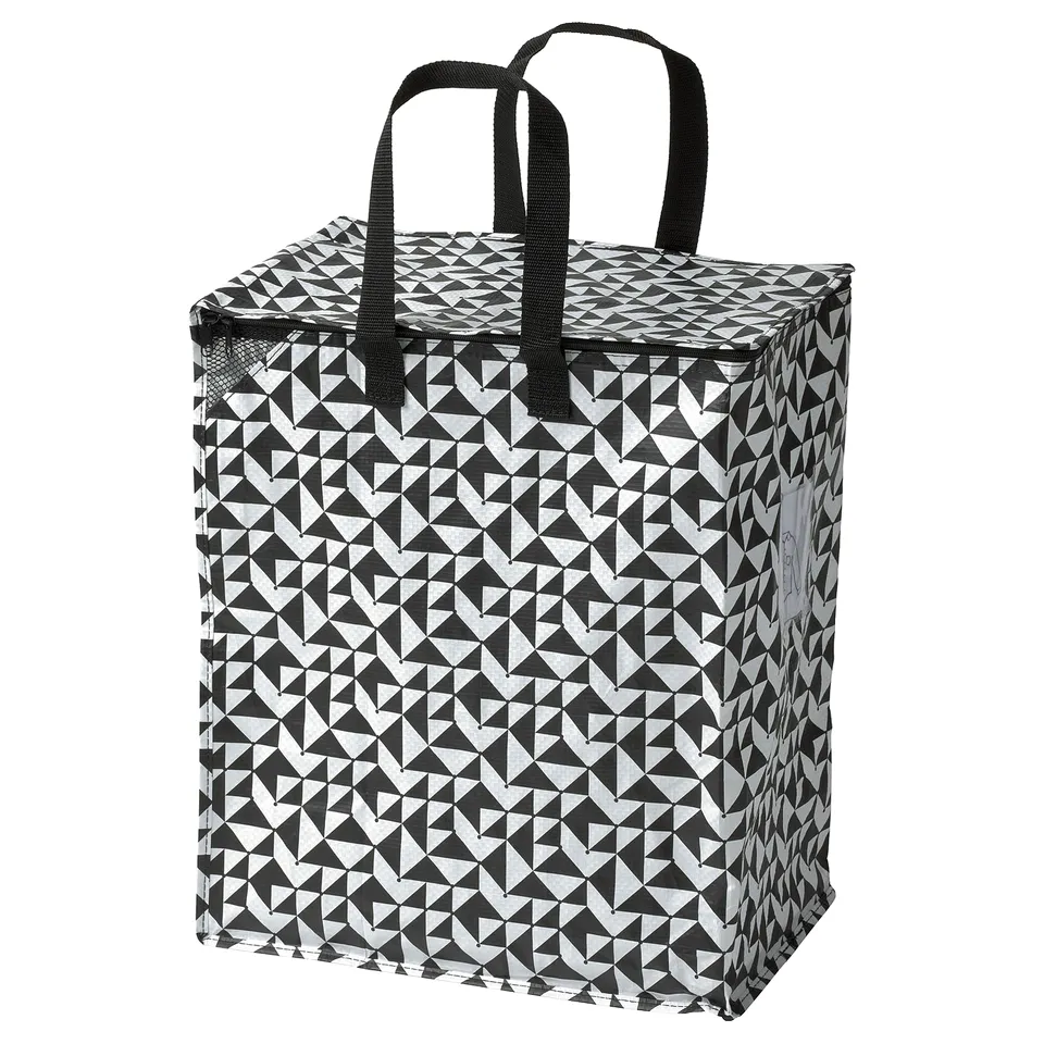 Black & white KNALLA reusable shopping bag with sturdy handles, ideal for groceries or laundry.