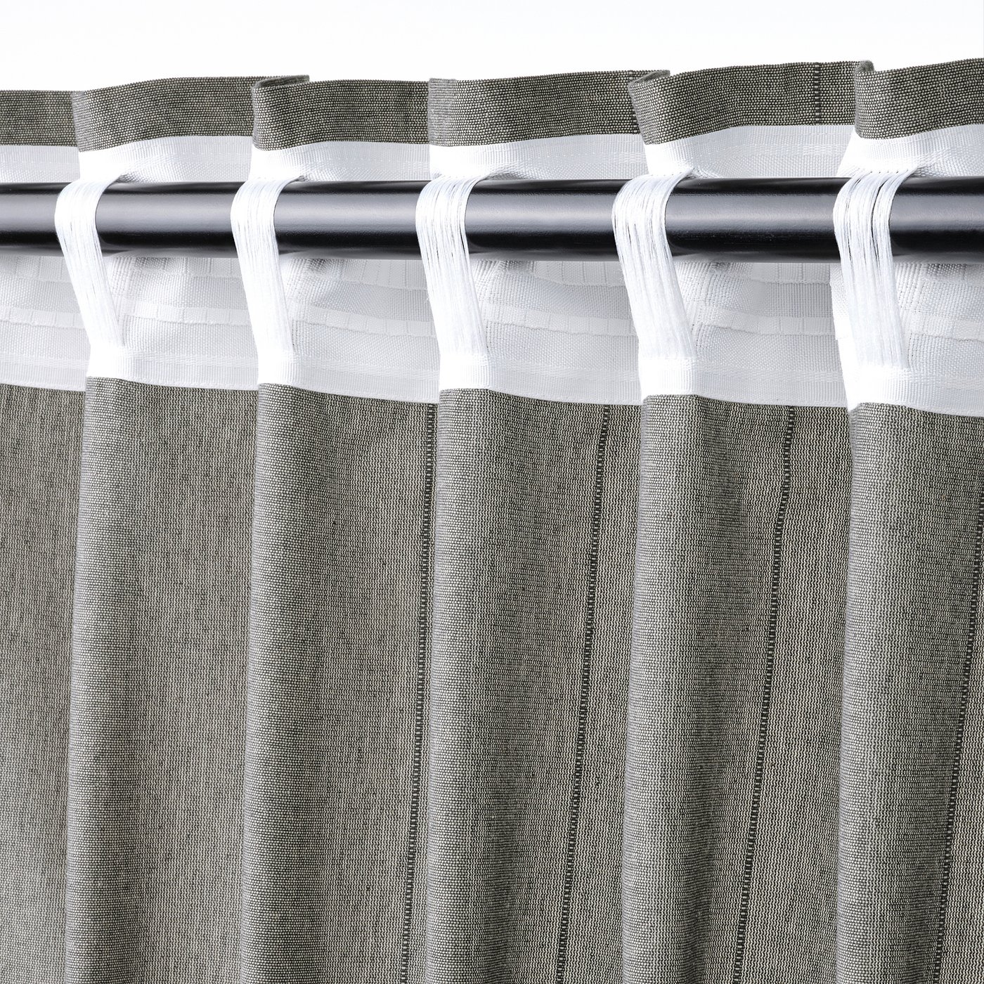 Dark grey LENDA curtains with header tape and linear weave, tied back for style.