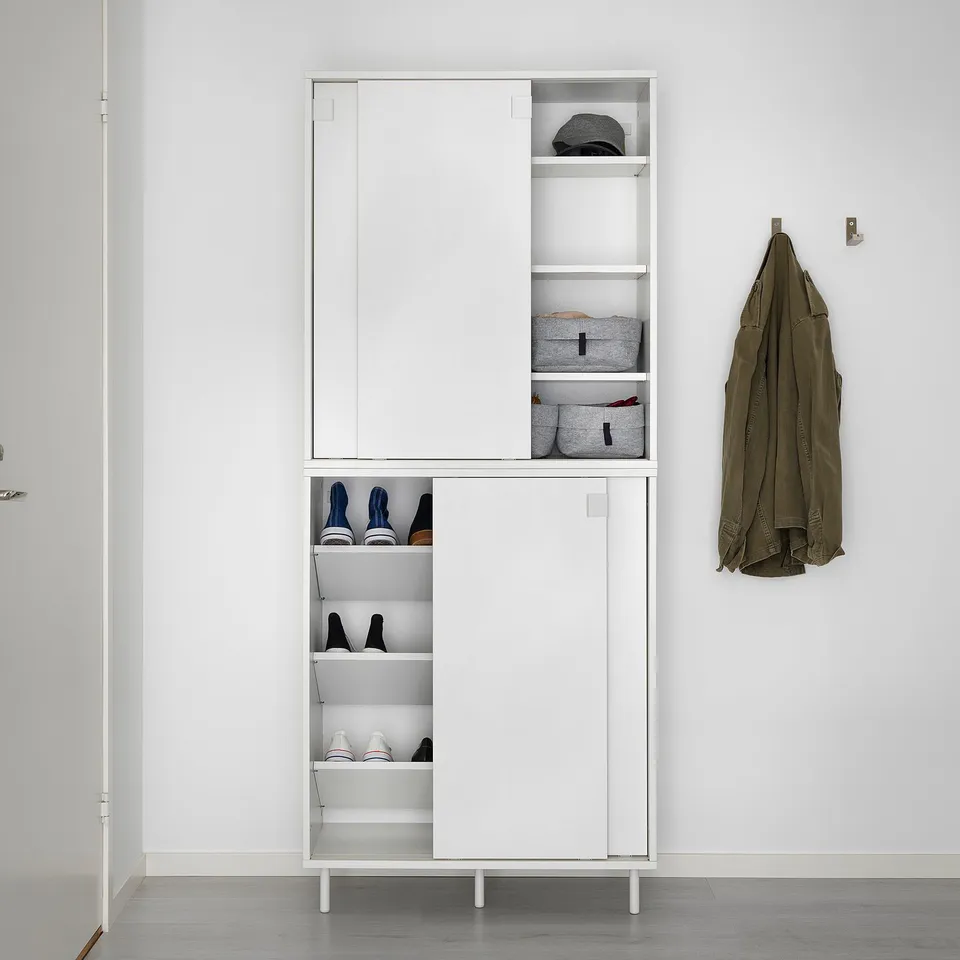 White MACKAPÄR shoe cabinet, 24 pairs, sliding doors, adjustable shelves, wall-mounted, top for accessories.