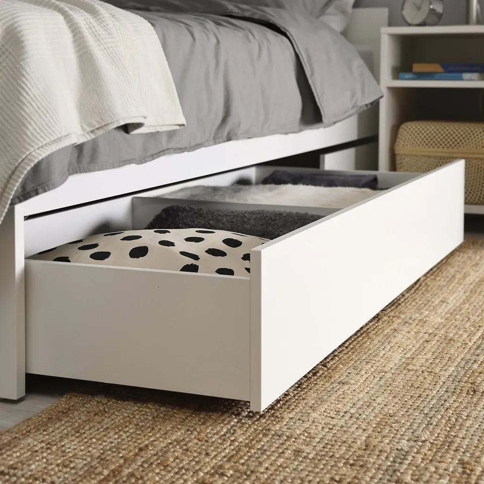 Bedframe with open storage drawer, showing organised storage under bed, ideal for linens.
