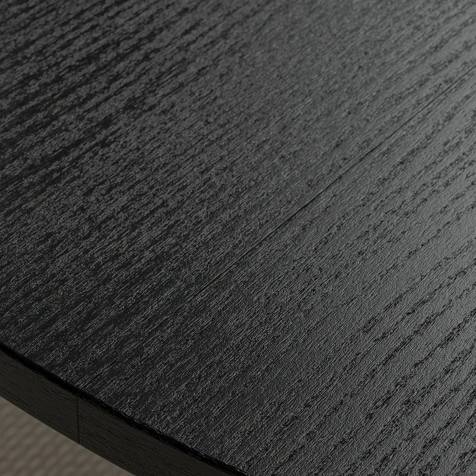 Smooth, dark wooden surface of a round conference table, showcasing its high-quality finish and sleek design.