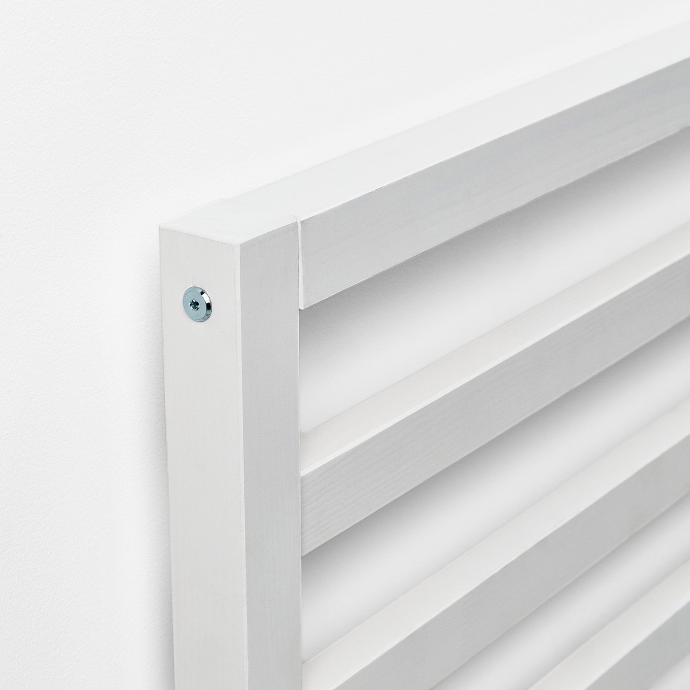 White wooden headboard with clean lines and visible screws.