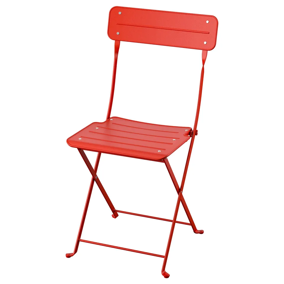 Red SUNDSÖ folding chair, small space, powder-coated steel, folds for easy storage.