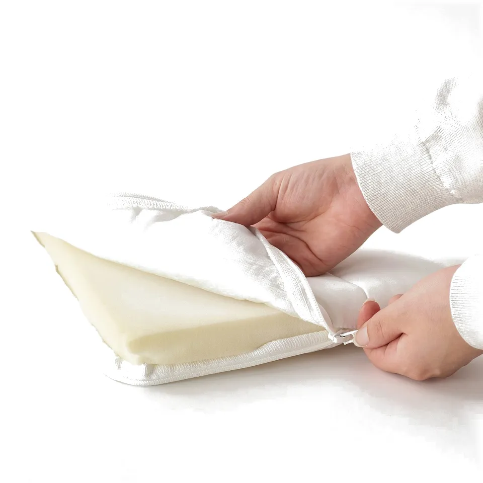 Person placing a mattress insert with a zip, showing ease of addition or removal.