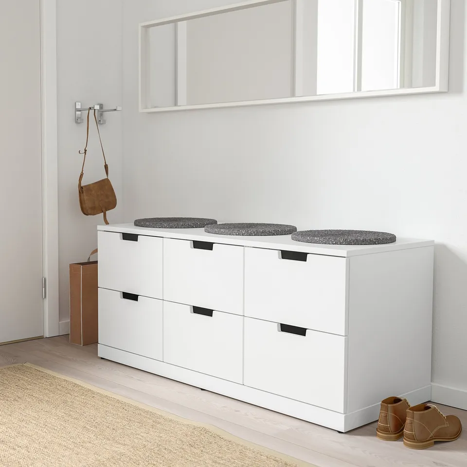 White NORDLI chest with stools, ideal for compact storage.