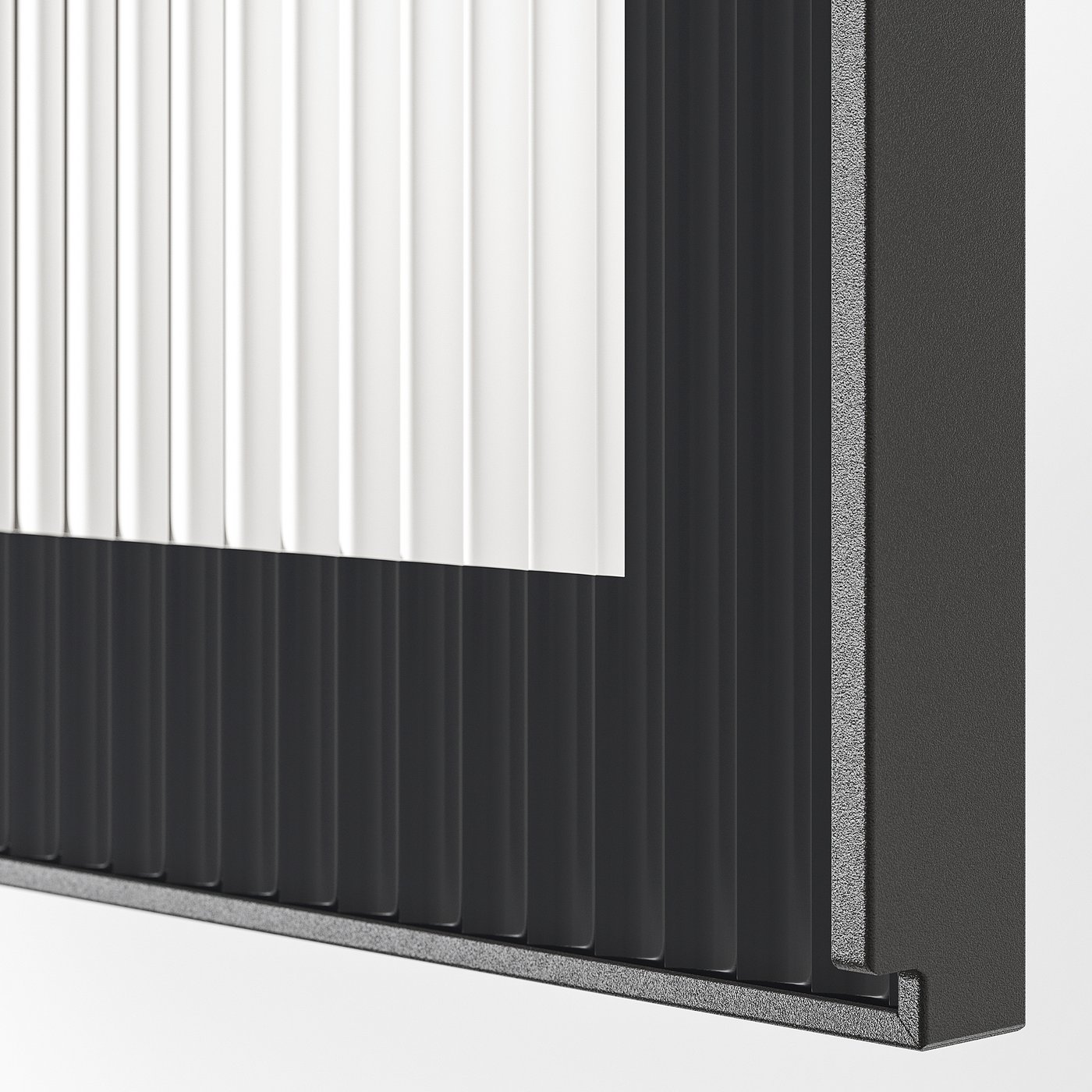 Close-up of modern kitchen cabinet door with sleek handle, featuring patterned texture and black finish.