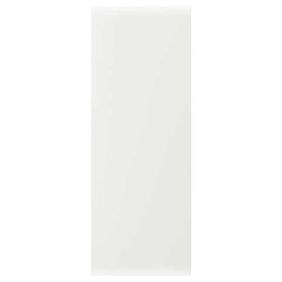 A VEDDINGE white cabinet door with a smooth, minimalist design, made from fiberboard and painted with polyurethane and acrylic finishes.