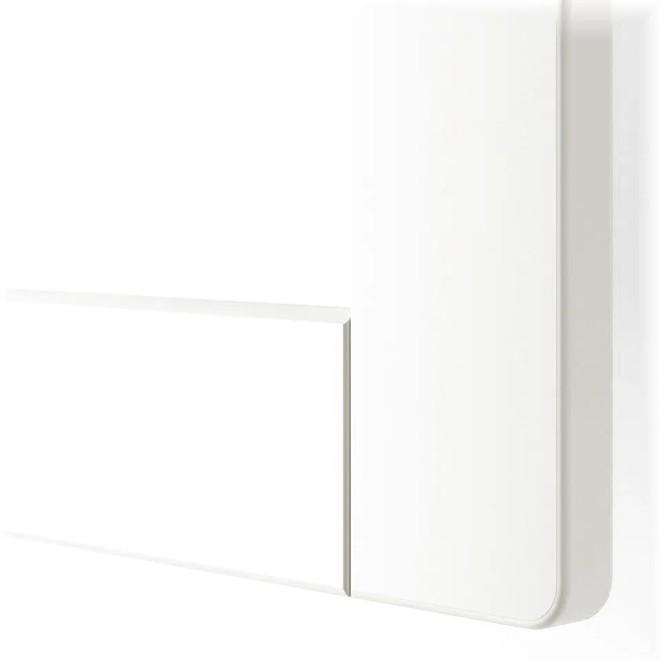 Close-up of white chest drawer edge, smooth finish, clean lines, sturdy build.