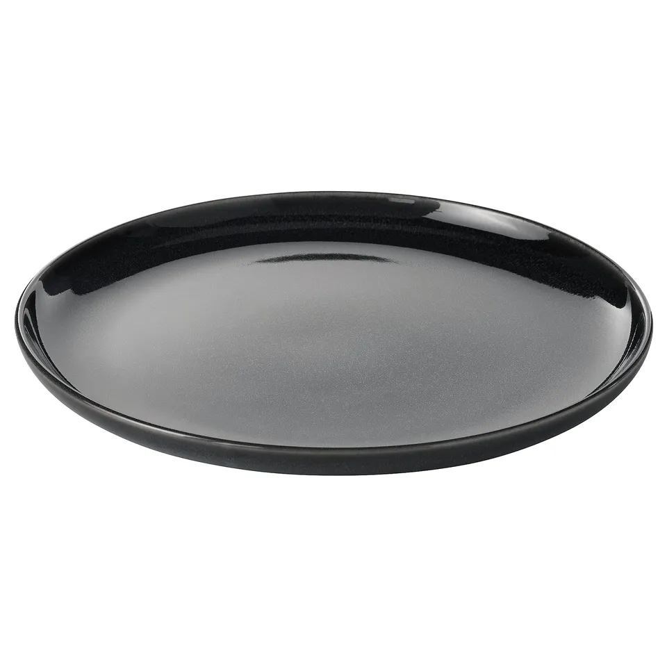 A single black GLADELIG plate made of stoneware with a glossy finish. It a round and sleek design, perfect for modern table settings.