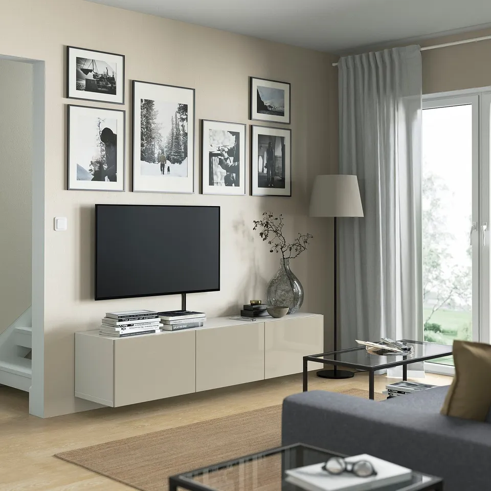 Modern living room with BESTÅ tv bench, gallery wall, and coffee table.