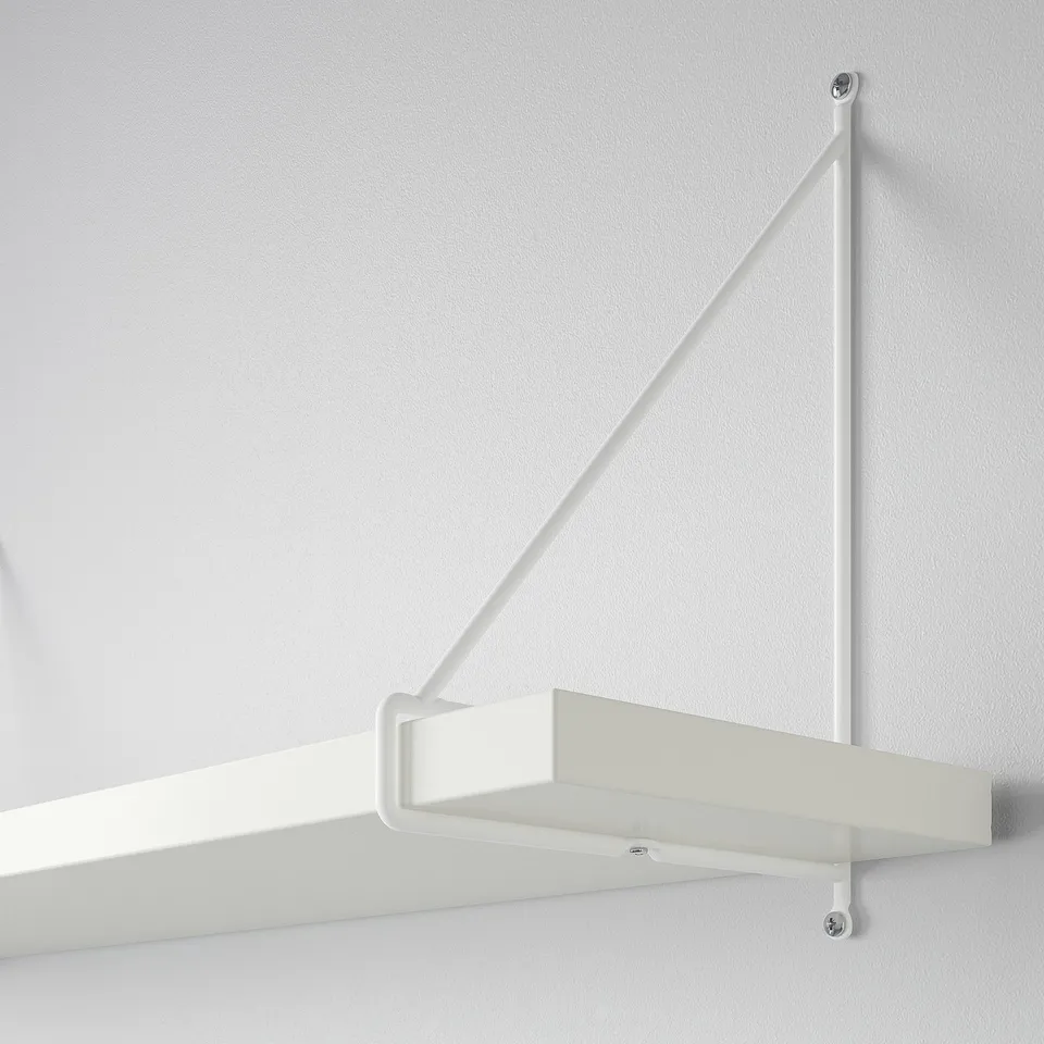 Modern white wall shelf with angled supports, securely mounted to the wall for stability.
