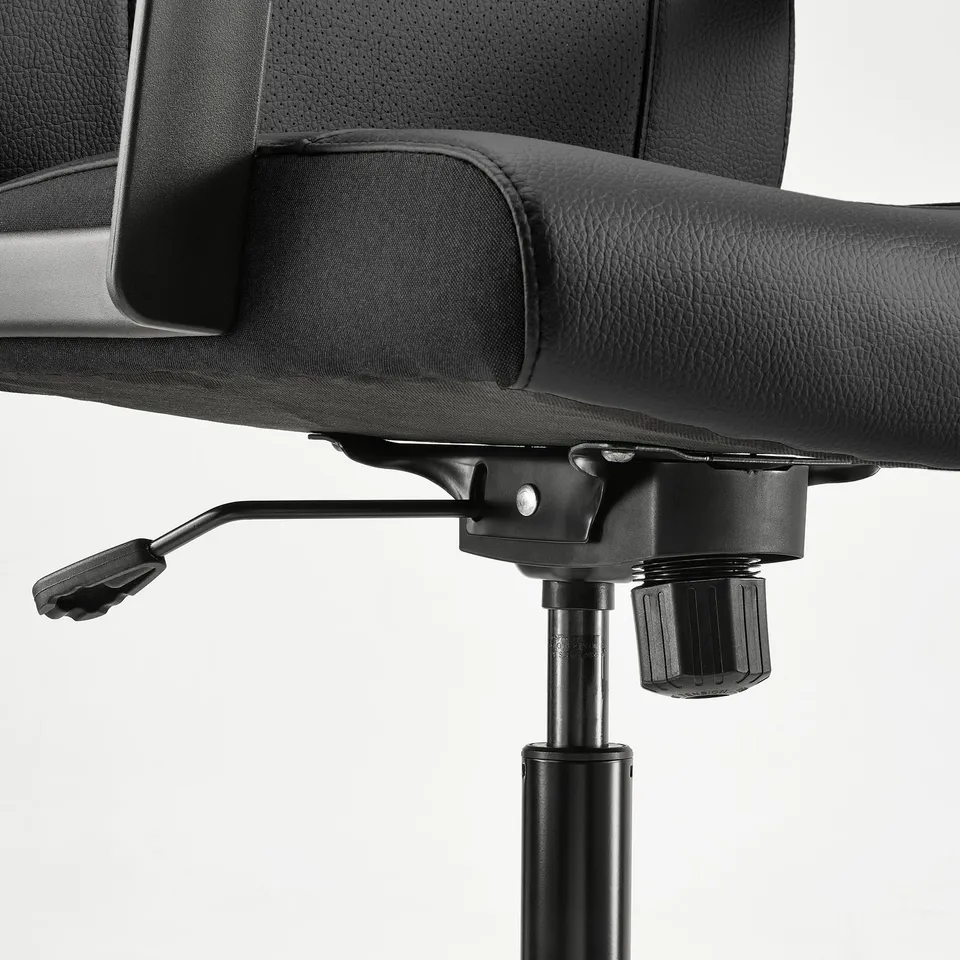 Black height-adjustable office chair.
