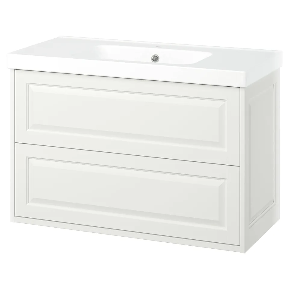 A TÄNNFORSEN white bathroom vanity with two spacious drawers and a ceramic sink, featuring classic elegance with bevelled edges.