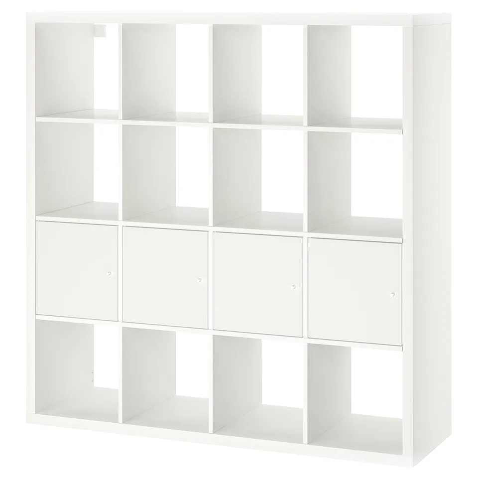 A white KALLAX storage unit, featuring multiple compartments and two hidden storage inserts, designed to keep items organised and hidden from view.