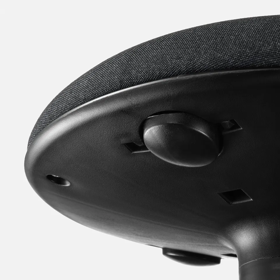 Close-up of ergonomic office chairs height adjuster, showcasing quality materials and design.