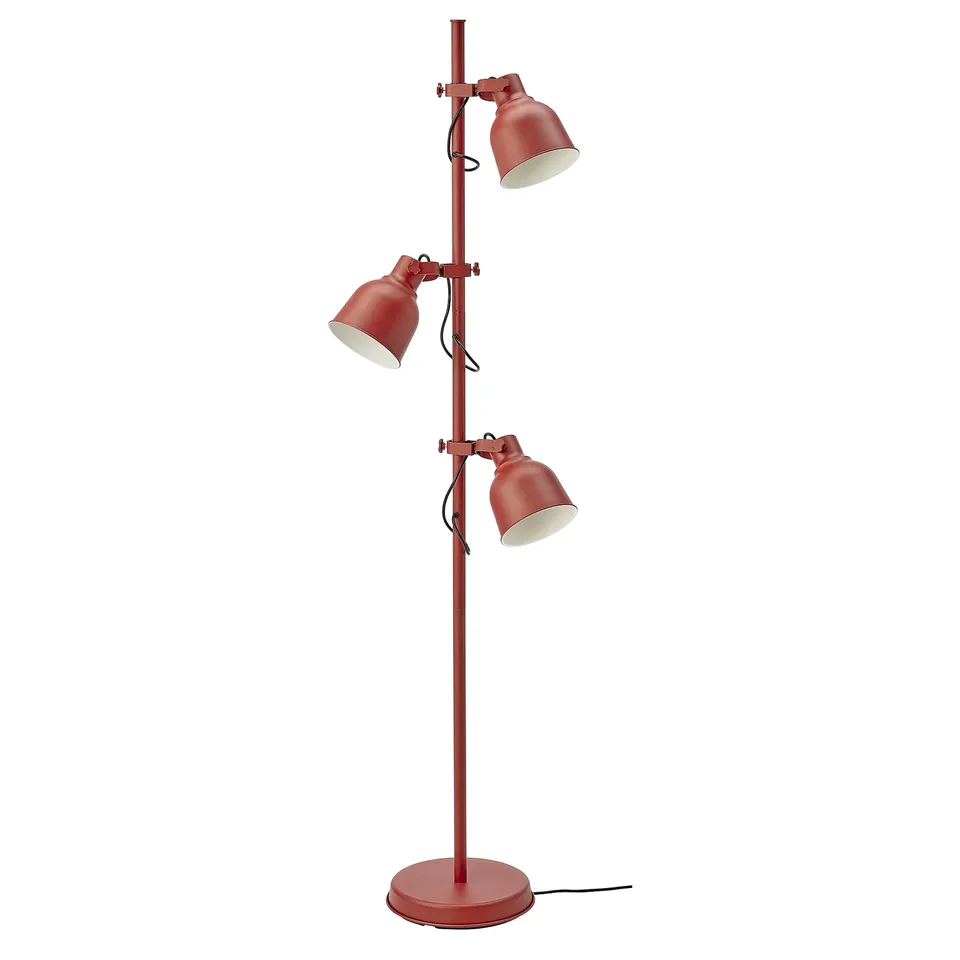 Red HEKTAR floor lamp with three adjustable, oversized metal shades for versatile lighting.