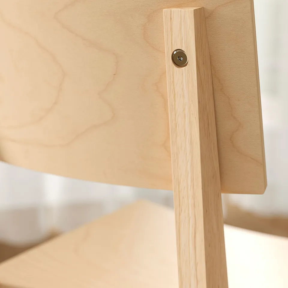 Wooden table crafted from sturdy, light-colored material. Smooth finish with visible wood grain and a small round metal fitting near the edge.