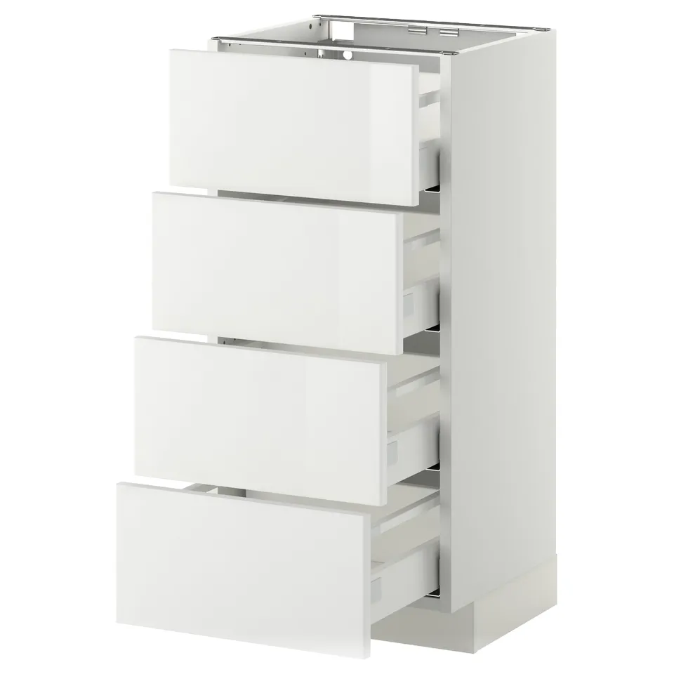 A white METOD kitchen cabinet with four drawers. It a sleek, modern design with high-gloss drawer fronts and a sturdy frame.