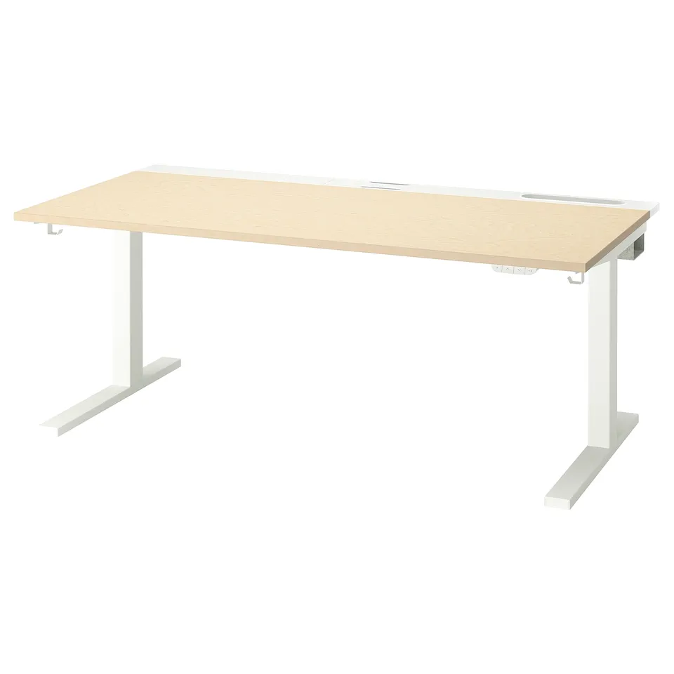 A light-colored MITTZON desk with a birch veneer top, featuring a white sit/stand underframe and dual motors.