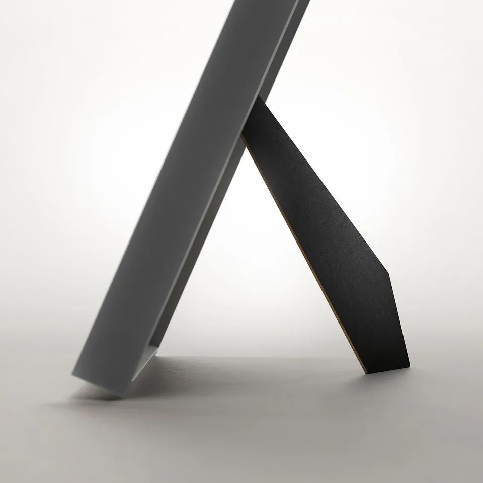 A sleek, black, adjustable picture frame with stand, displaying modern design. It can be positioned vertically or horizontally.