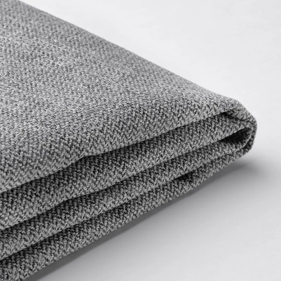 Folded grey fabric close-up, showcasing texture and quality.
