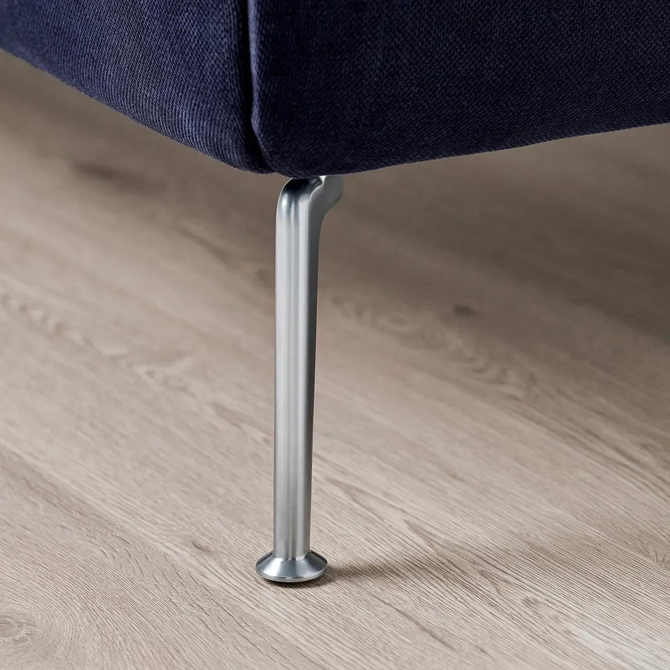 Close-up of grey upholstered bed leg on wooden floor showcasing quality finish.