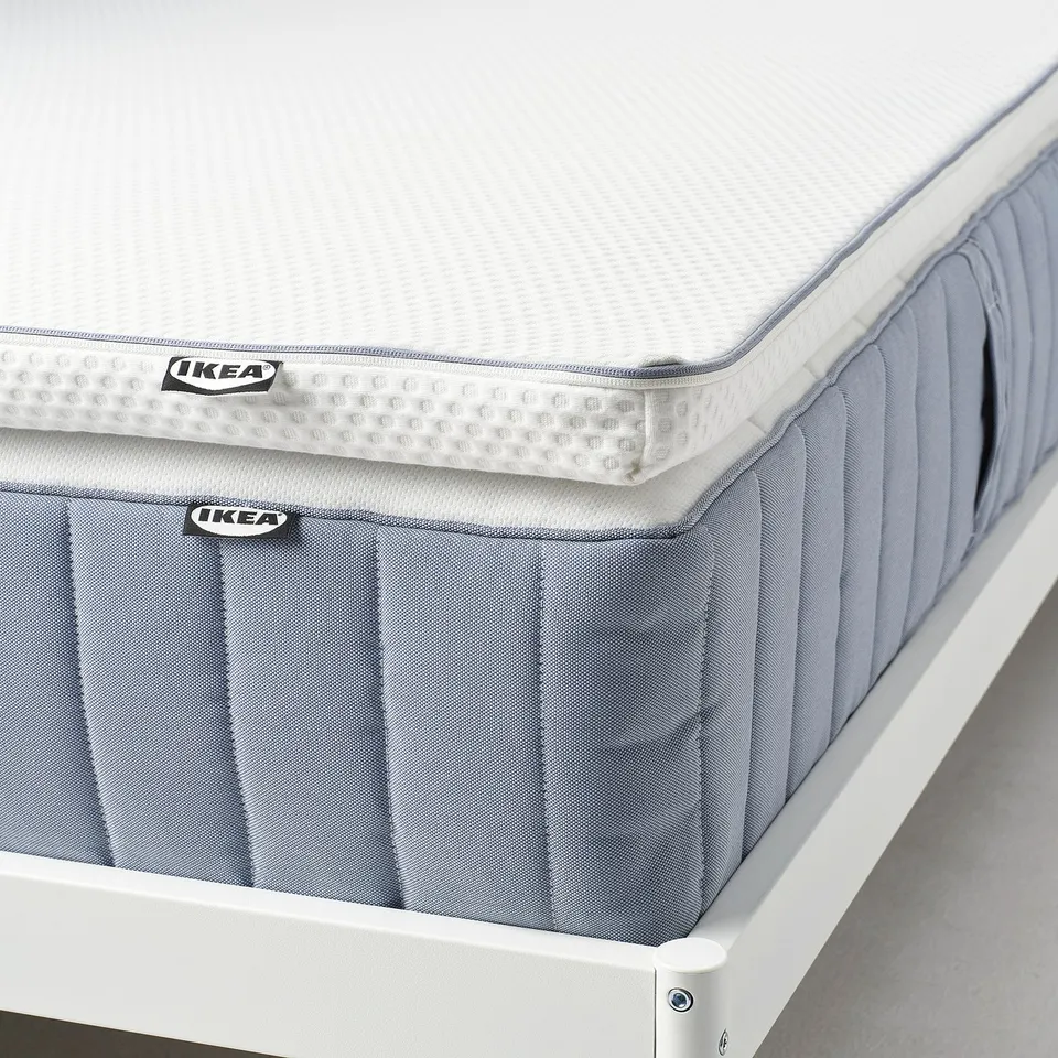 Ikea NÄSTABERG mattress pad, featuring memory foam for pressure relief and dual-sided fabric for cool and warm comfort.