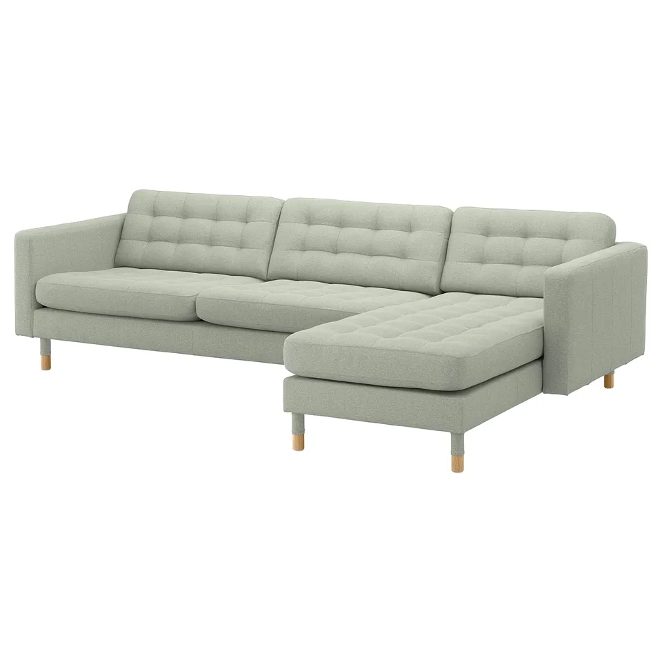 Modern grey fabric l-shaped sofa with tufted back and seat cushions, light wooden legs.