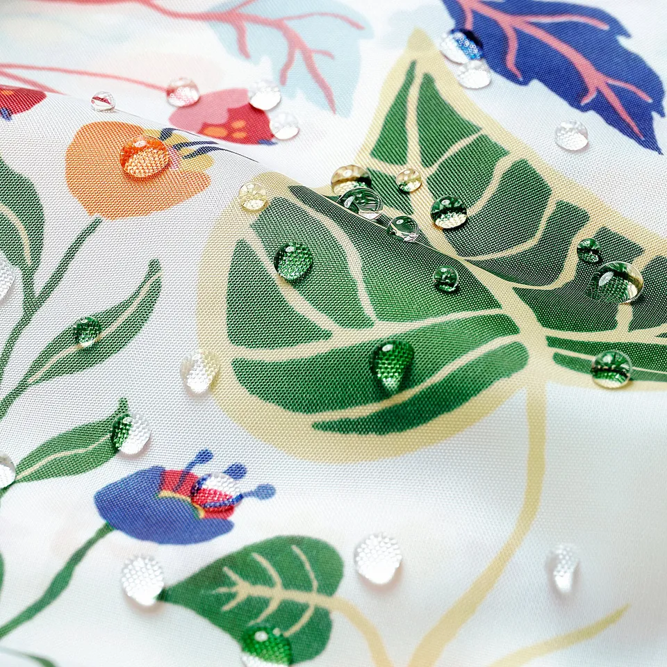 Vibrant floral patterned shower curtain, water-repellent, with colourful leaves and flowers.