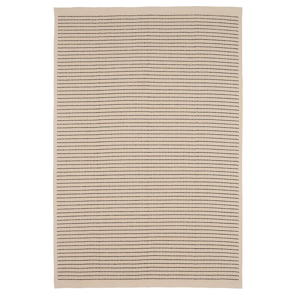 A beige and black striped, rectangular STARREKLINTE rug made of 100% cotton, ideal for living or dining spaces.