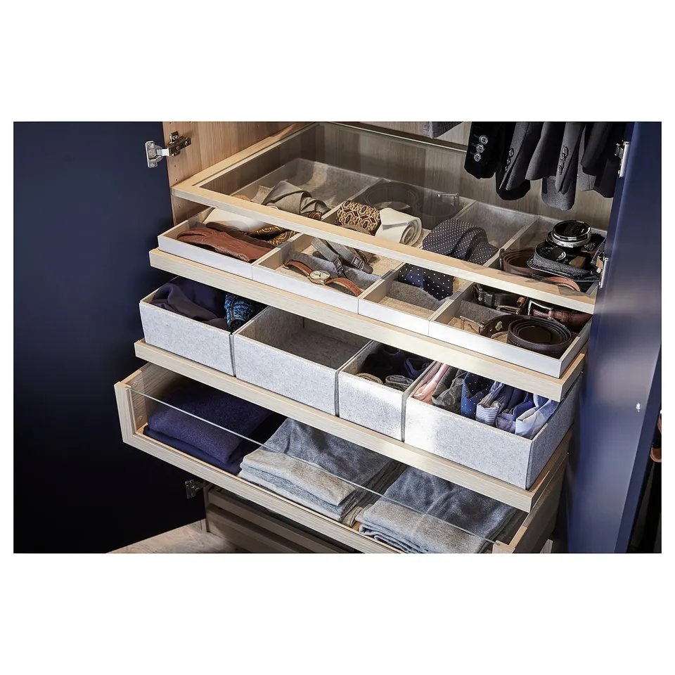 KOMPLEMENT drawer organiser in light grey, storing ties, belts, and more, with felt liners.