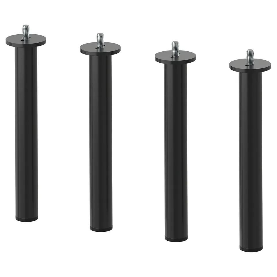 Four black metal poles with round tops arranged side by side.