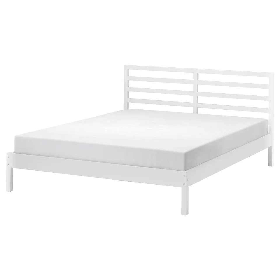 White wood TARVA bed, simple clean design with slatted headboard and sturdy legs.