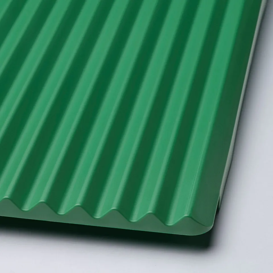Green plastic dish drainer with ribbed design. High-quality, durable material.