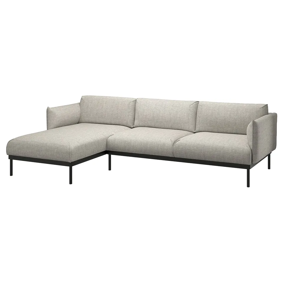 Highbacked grey fabric l-shaped sofa with black metal legs.