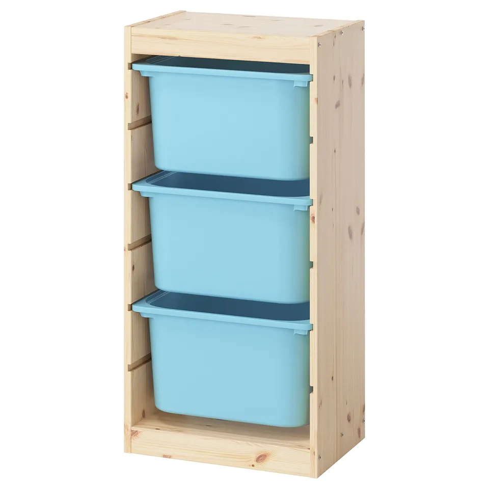 TROFAST light pine shelf with three blue plastic storage boxes.