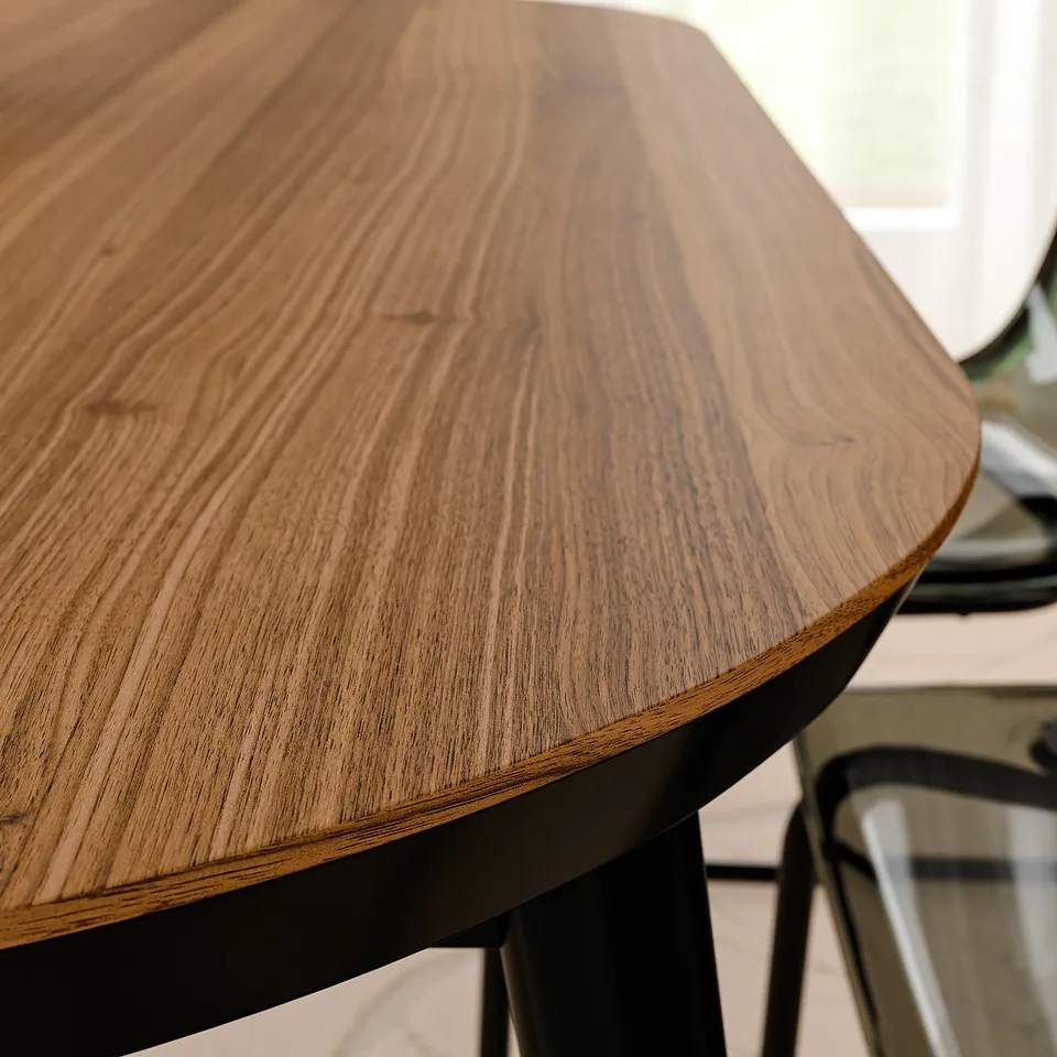Modern round table with smooth, polished wooden top on robust black metal legs. Natural wood grain displays rich, warm tones.