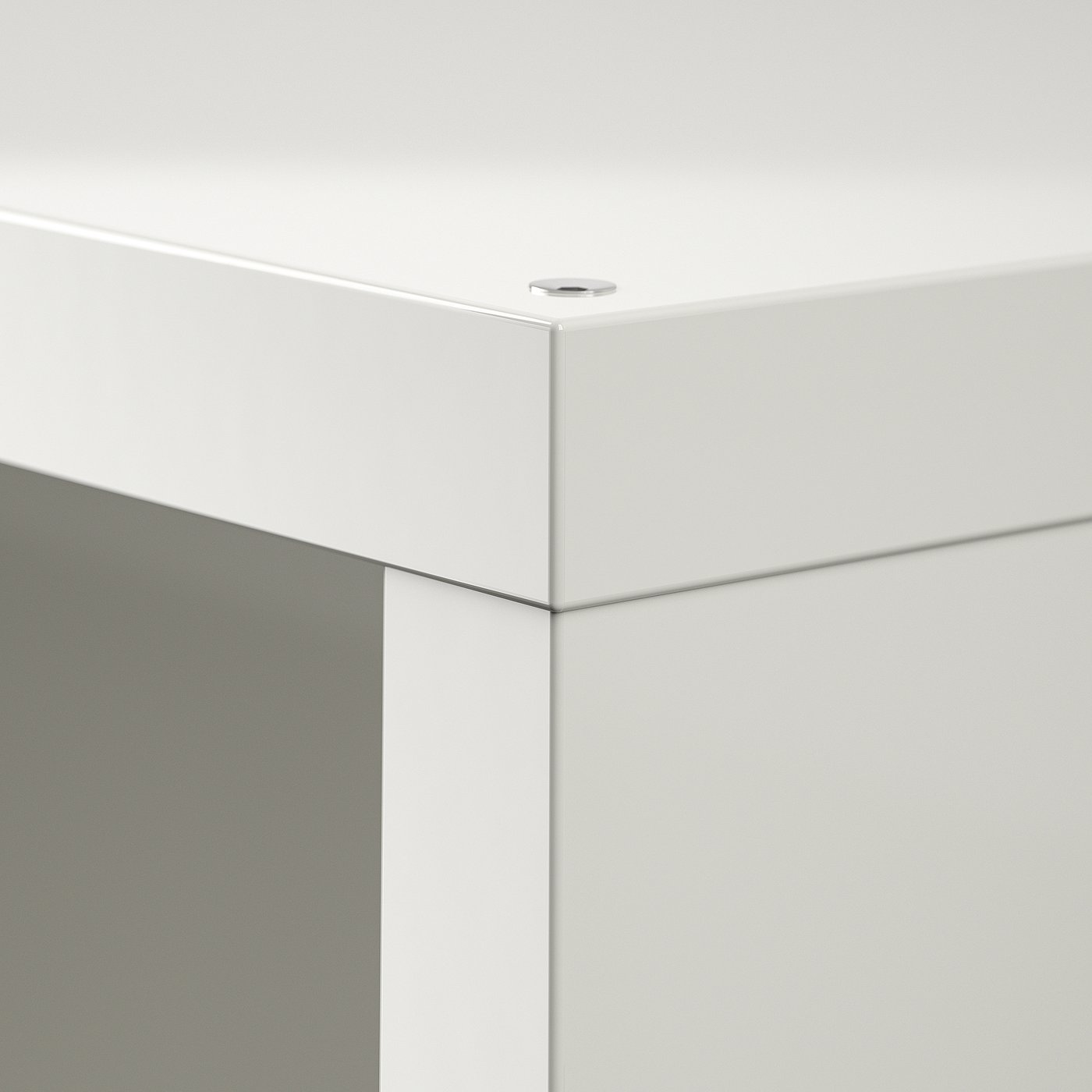 Close-up of clean, white KALLAX shelving corner, showcasing smooth finish and quality construction.