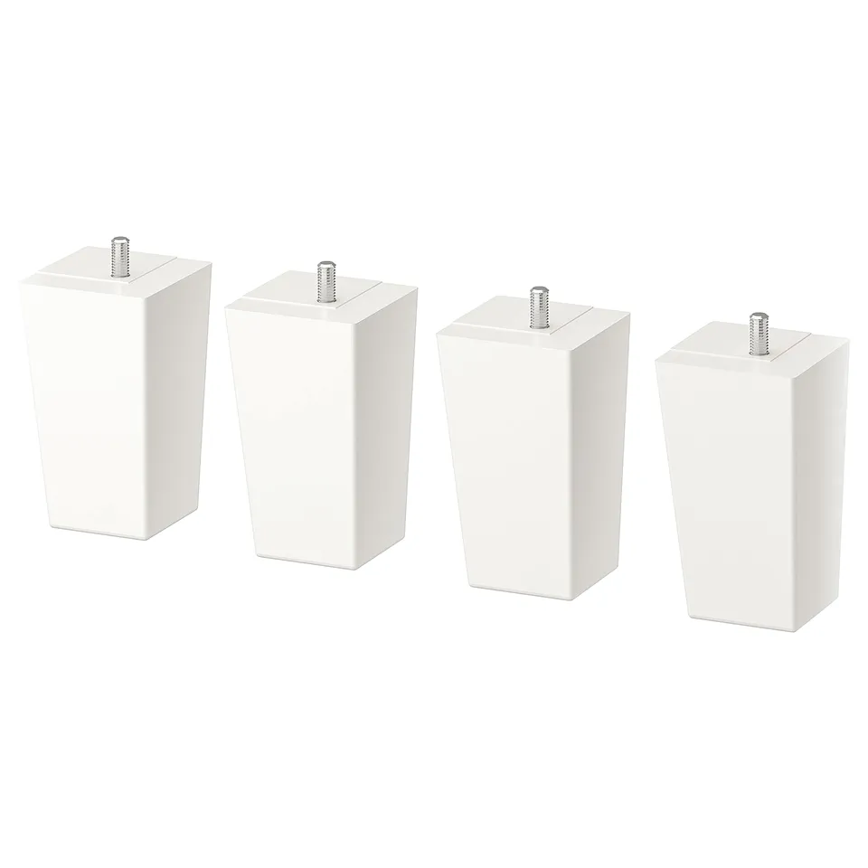Four white furniture leg attachments with screws, in a row.
