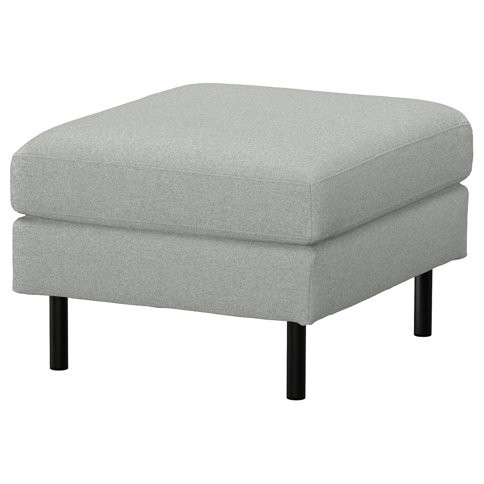 Grey upholstered footstool with metal legs.