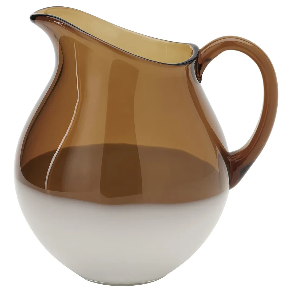 Brown glass pitcher, unique pattern, curved handle, glossy finish, large base.